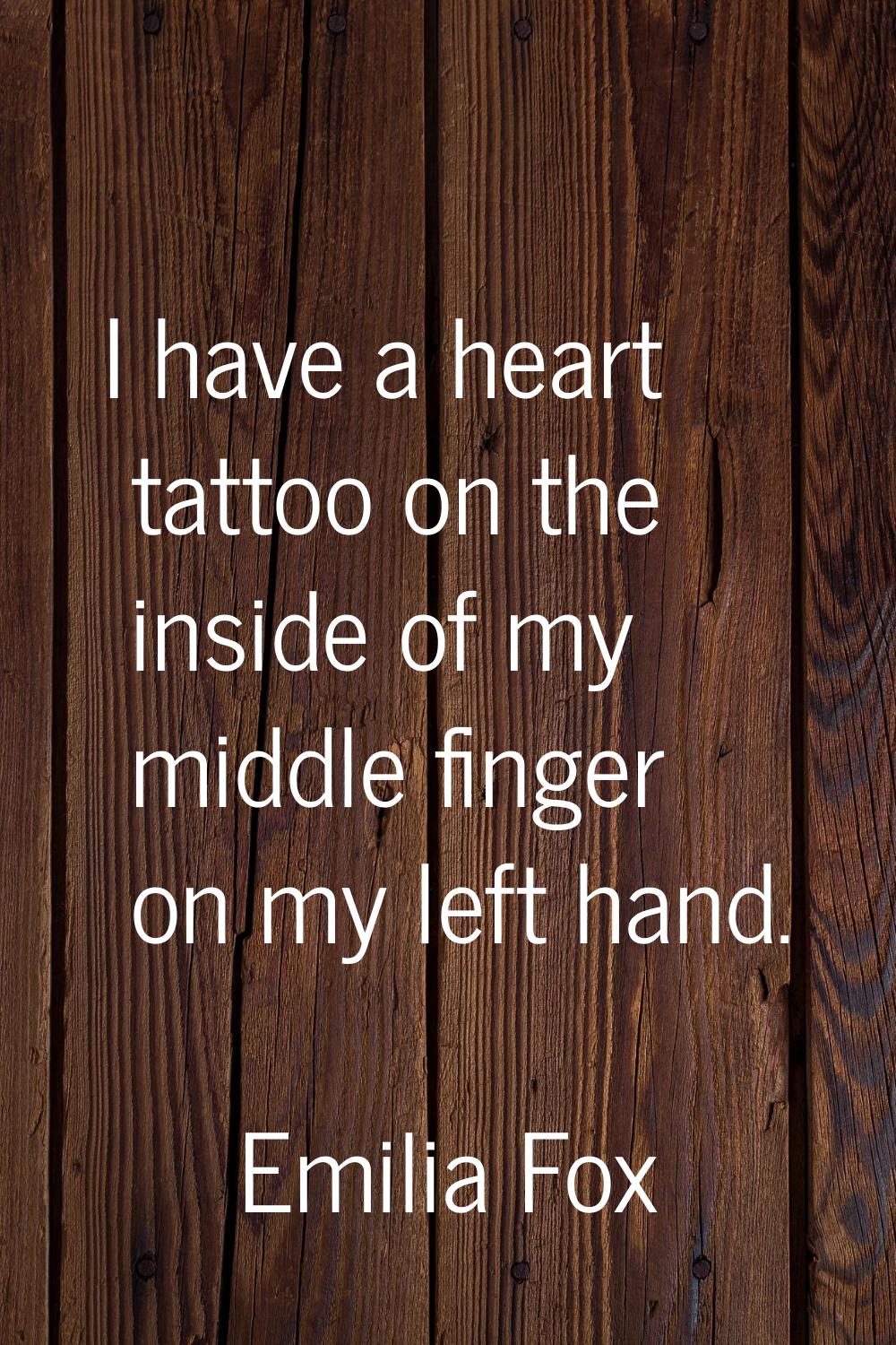 I have a heart tattoo on the inside of my middle finger on my left hand.
