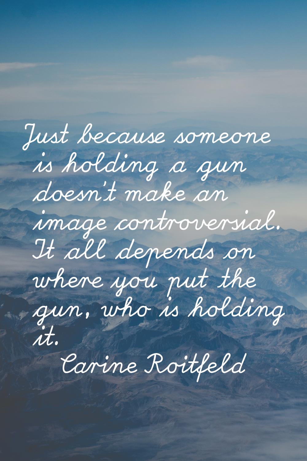 Just because someone is holding a gun doesn't make an image controversial. It all depends on where 