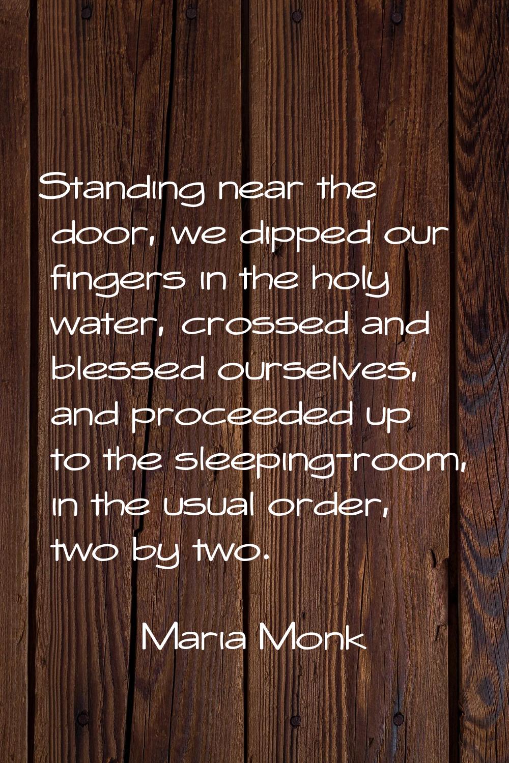 Standing near the door, we dipped our fingers in the holy water, crossed and blessed ourselves, and