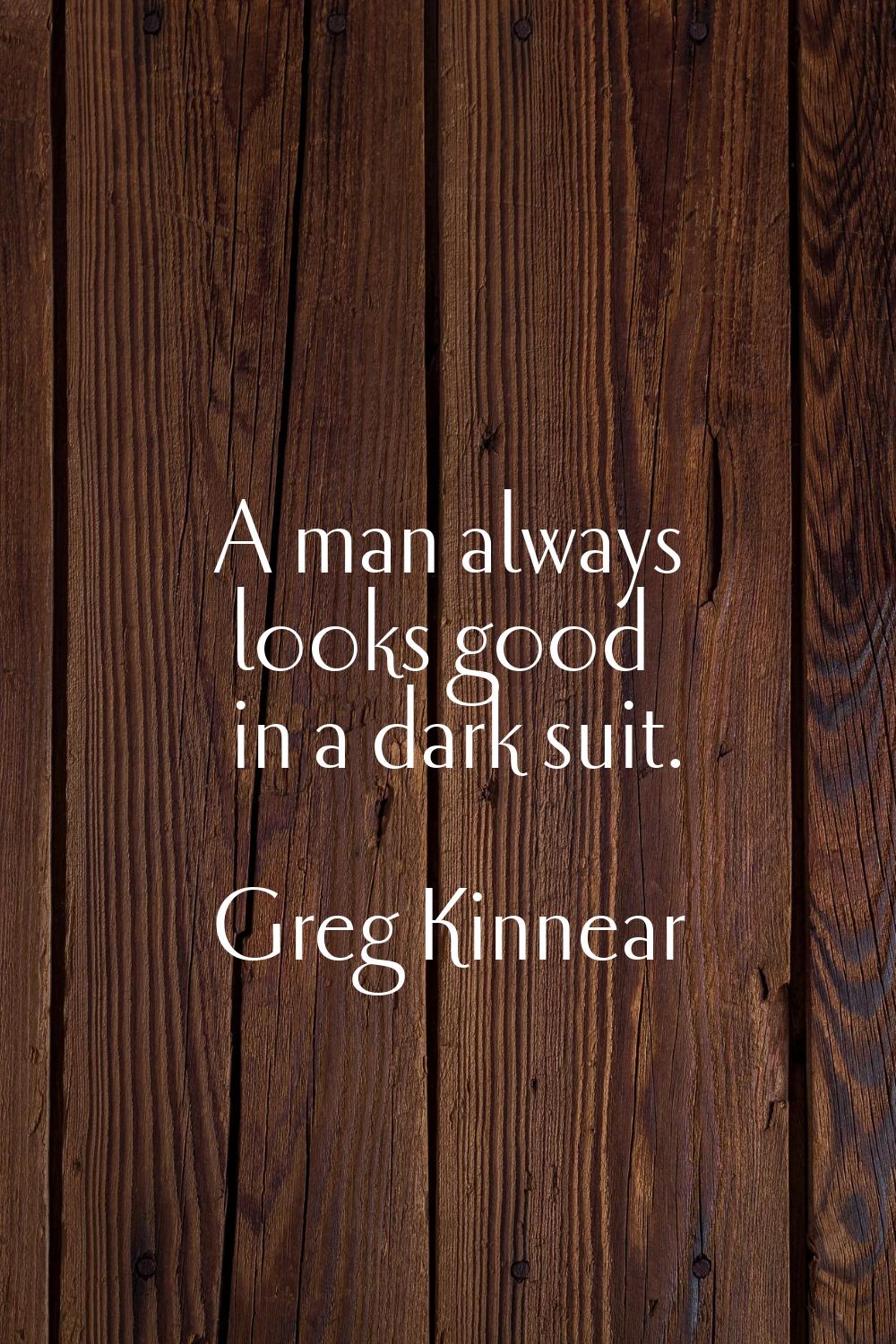 A man always looks good in a dark suit.